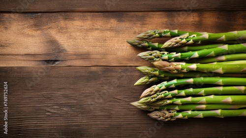 Fresh green asparagus on a wooden background. Delicious, healthy vegetables. Vegetarianism.