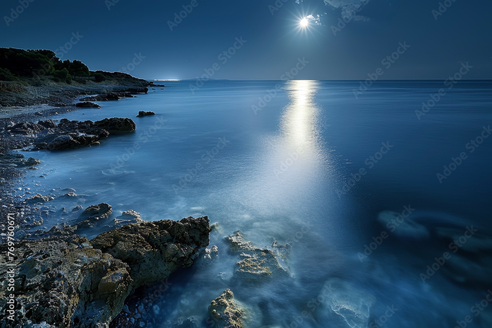 A Tranquil Coastline Illuminated by Moonlight: The Silence of the Night and the Gentle Sound of the Sea Waves Invite Peaceful Rest
