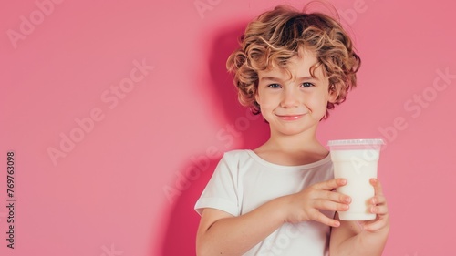 child boy holding milk and One arm muscle stretching pose. photo