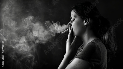 World No Tobacco Day Picture of a pregnant woman covering half her nose with cigarette smoke.