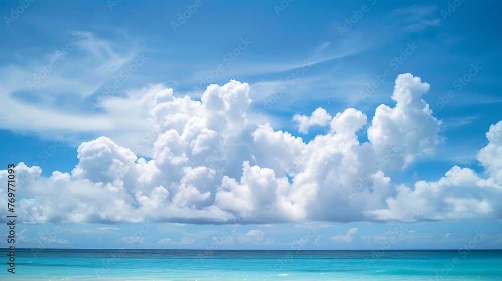 Tranquil ocean waterscape under a serene blue sky with white fluffy clouds on a sunny day Tranquil ocean waterscape under a serene blue sky with white fluffy clouds on a sunny day