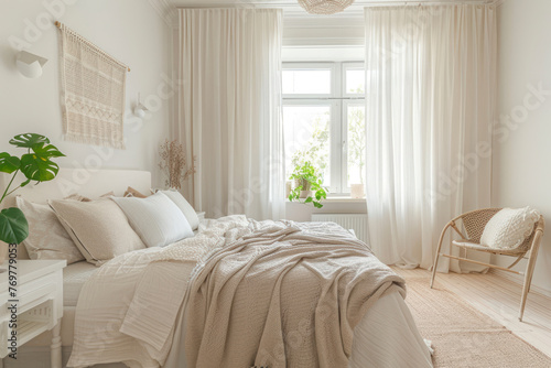 Bright studio apartment in Scandinavian style and warm pastel white and beige colors.