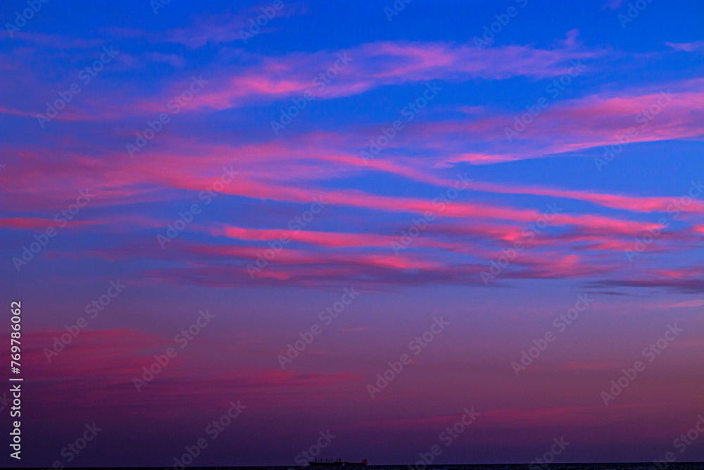 Beautiful clouds in a colorful sky at sunset in summer