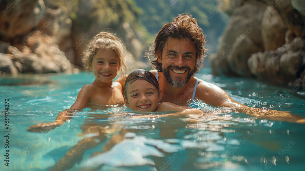 A happy family has fun in a natural thermal pool.