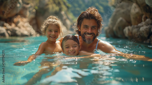 A happy family has fun in a natural thermal pool.