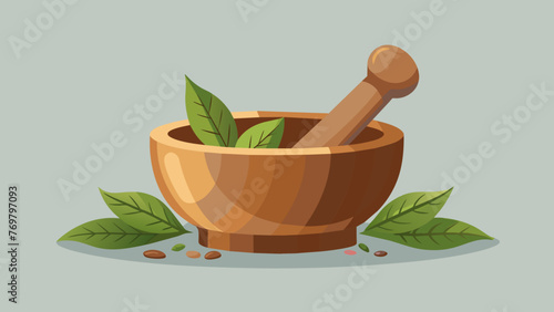  A wooden mortar and pestle filled with crushed dried herbs ready to be used in a healing tonic. photo
