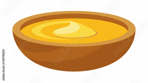  A closeup of a wooden bowl filled with a homemade salve made from natural ingredients such as beeswax and infused oils. This salve is often used