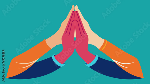  A pair of hands are clasped together palms facing up as a person practices a meditative stance in Tai Chi.