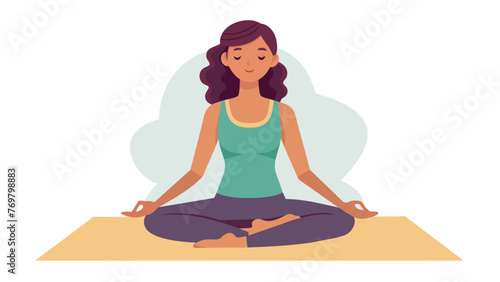  A woman sits crosslegged on a mat her eyes closed and hands gently resting on her knees. A serene smile graces her lips encapsulating the