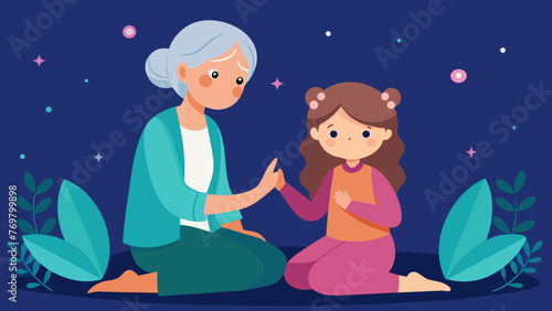  An elder woman and a young girl sit together holding hands and praying to the spirits for guidance as they continue to pass on ancestral