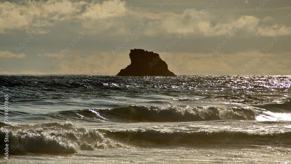 Silhouette of a small island off the coast at sunrise, in Zipolite, Mexico Silhouette of a small island off the coast at sunrise, in Zipolite, Mexico