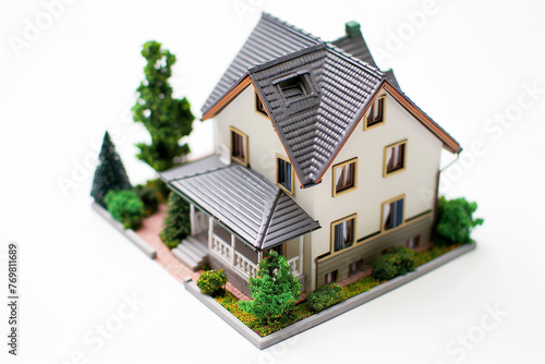 A miniature house shot from above and isolated on a white background