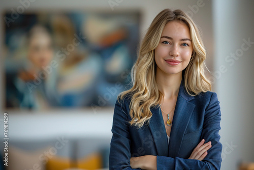 Portrait of a Confident Young Caucasian Businesswoman Standing in Office in a Blue Business Suit. Successful Corporate Manager Posing for Camera with Crossed Arms, Smiling Cheerfully © AI_images