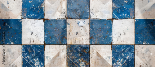 The texture of an old blue and white retro vintage tile exudes a timeless allure  with its weathered surface bearing traces of history.