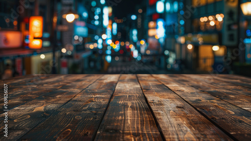 Empty wooden table, with Kabuki Cho Shinjuku Blur bokeh view photo