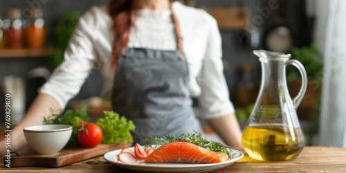 A woman standing in front of a cutting board with raw salmon and a carafe of Fish oil, preparing to cook