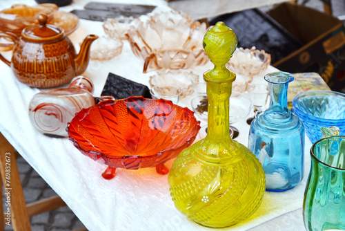 Set of glass decanter jug, vase, fruit stand old vintage glassware garage sale on flea market.