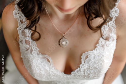 overhead view of brides neckline with a dainty locket