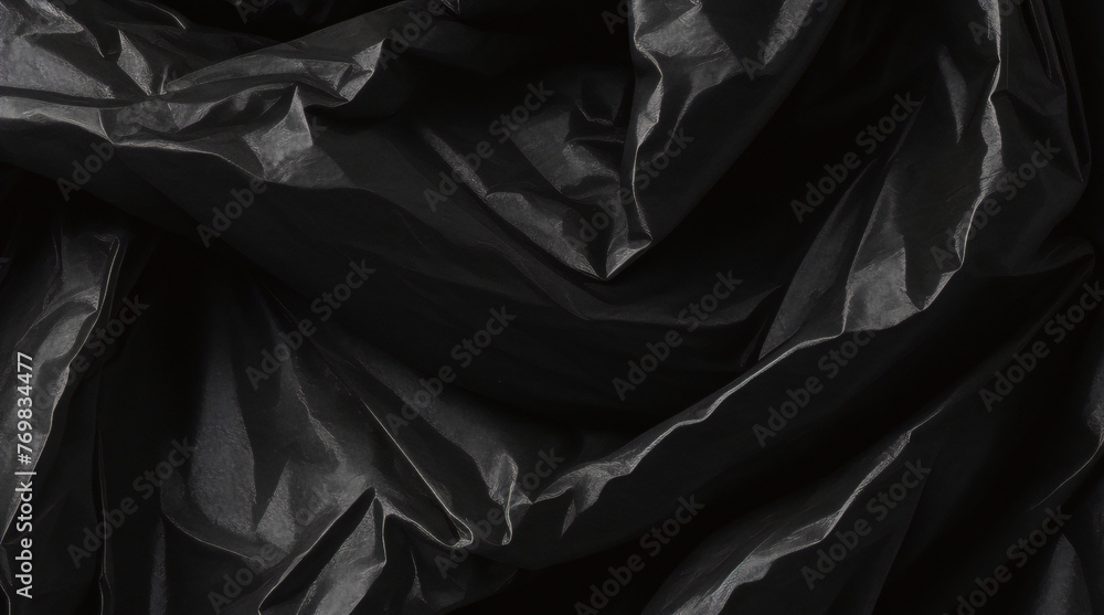 Obraz premium full frame abstract background of crumpled black plastic film bag