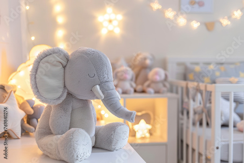 Cozy scandinavian newborn baby room with gray plush elephant ,white stars lamp and children accessories. © Hunman