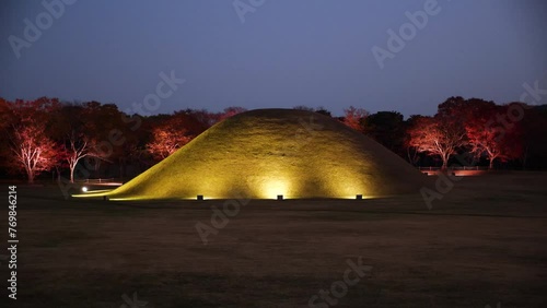Large Ancient Tombs of Kings of Silla dynasty in Gyeongju, tumuli royal park at night. Green grass tombs in South Korea. High quality 4k footage photo