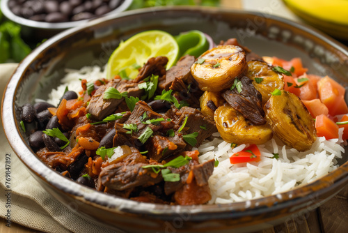 Pabellon Criollo dish featuring rice, black beans, tender beef, and sweet fried plantains. Venezuelan dish.