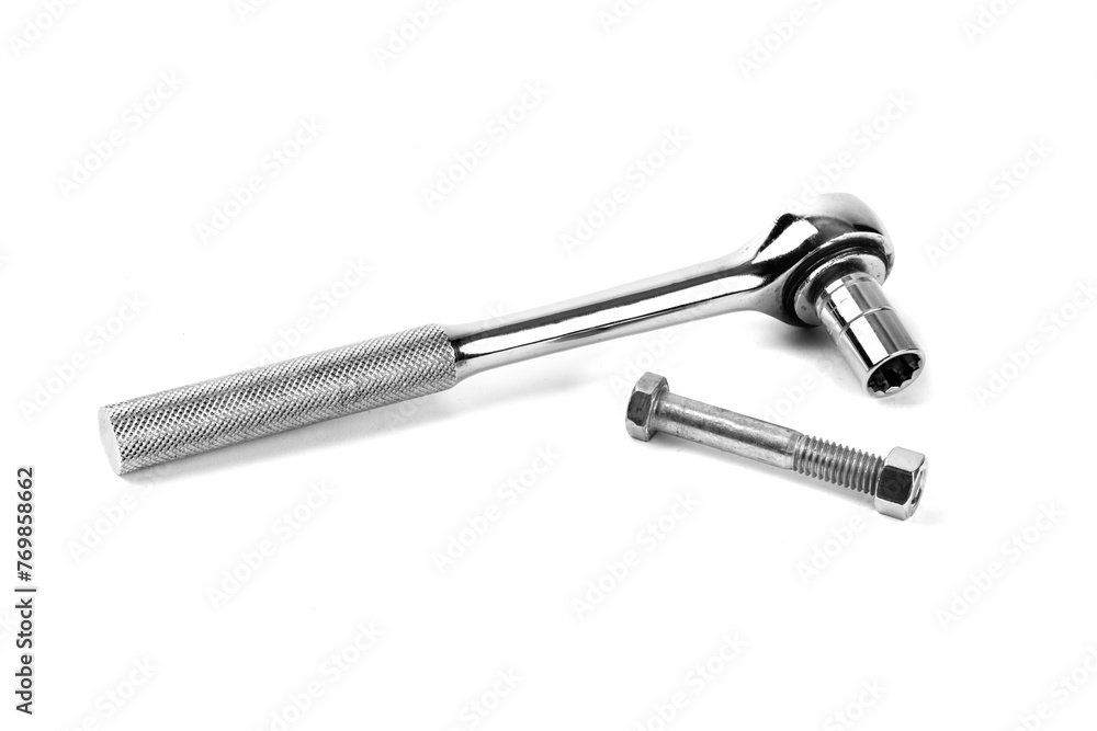 A socket wrench and ratchet handle with a machine bolt and nut isolated on white A socket wrench and ratchet handle with a machine bolt and nut isolated on white
