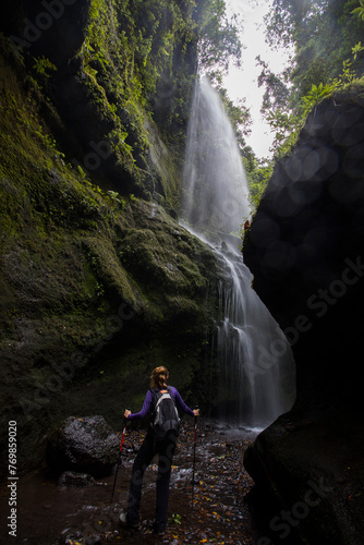 A young woman in Tilos waterfall, La Palma Island, Canary Islands.