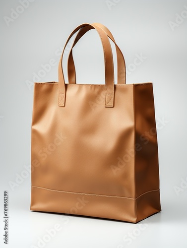A tan bag with a brown handle