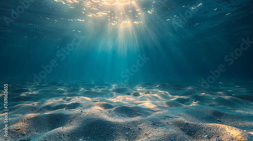 Clean underwater background with sunlight, rays of the sun from the surface. Clean, clear and plastic free ocean. Sea background. © JMarques