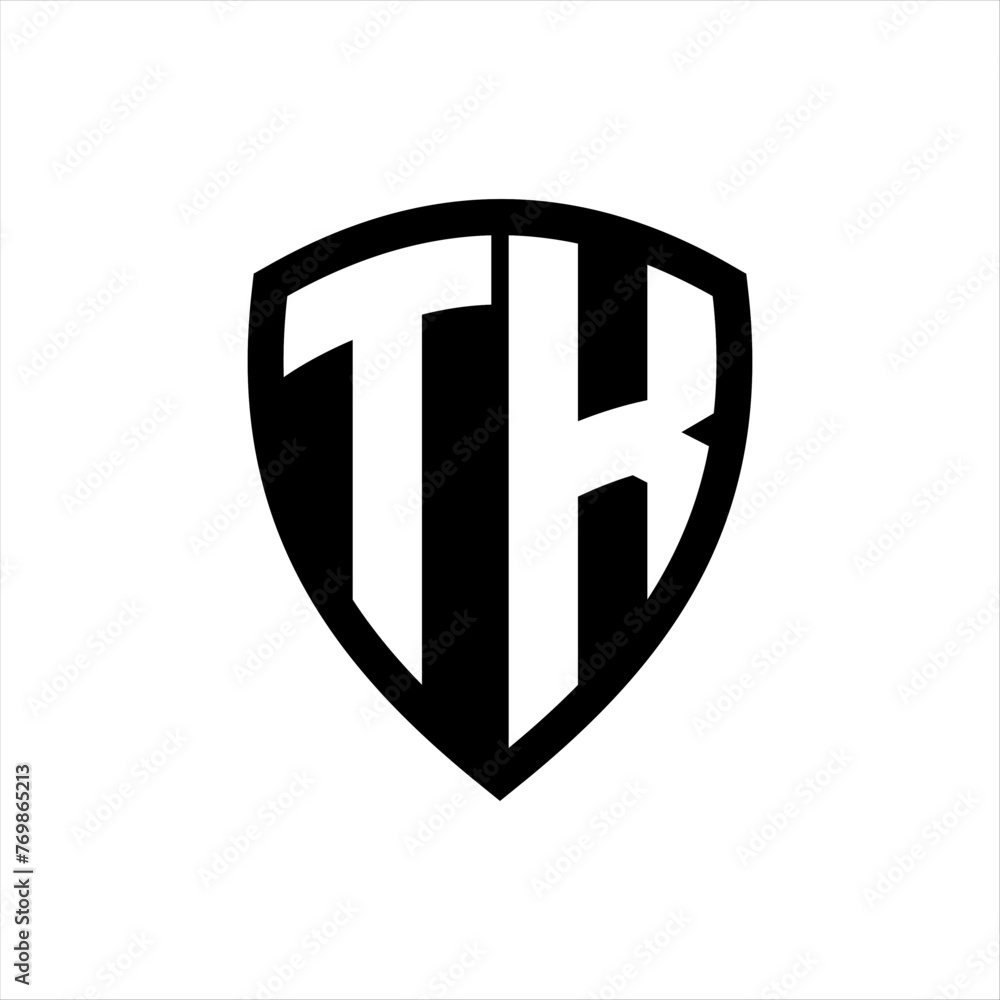 TK monogram logo with bold letters shield shape with black and white color design TK monogram logo with bold letters shield shape with black and white color design