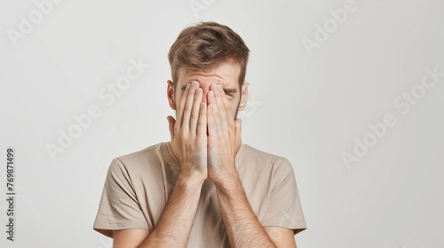 Man Covering Face With Hands