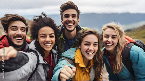 Young adult friends on a hike celebrate reaching the summit, smiling to camera, close up