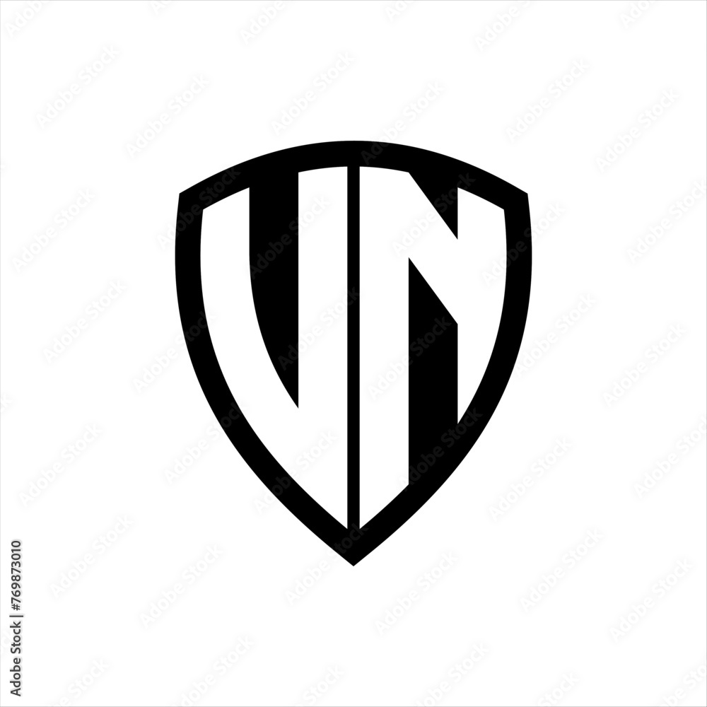 UN monogram logo with bold letters shield shape with black and white color design UN monogram logo with bold letters shield shape with black and white color design