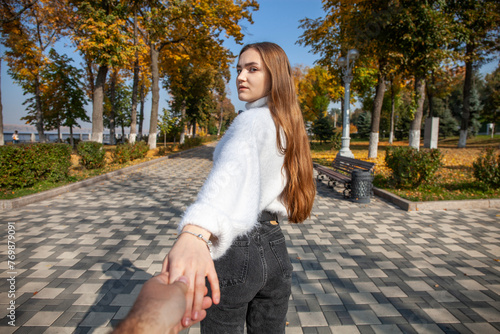 Follow me, young sexy girl holding her boyfriends hands