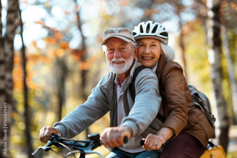 Naklejka premium Elderly senior couple, old man and lady, happily riding bicycles in the park, concept of active aging and retirement leisure.