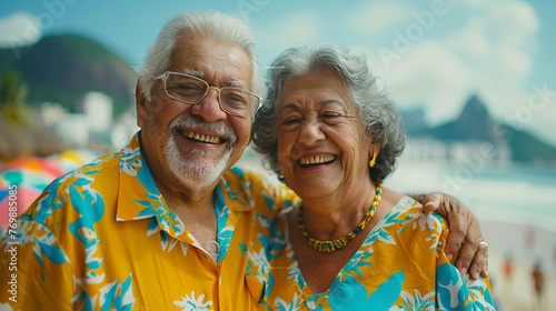 A joyful senior couple from Brazil laughing together on a beach in Rio photo