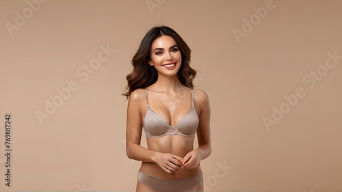 Studio no retouch photo of positive adorable lady dressed lingerie enjoying perfect shape empty space isolated brown color background © Hanna Ohnivenko