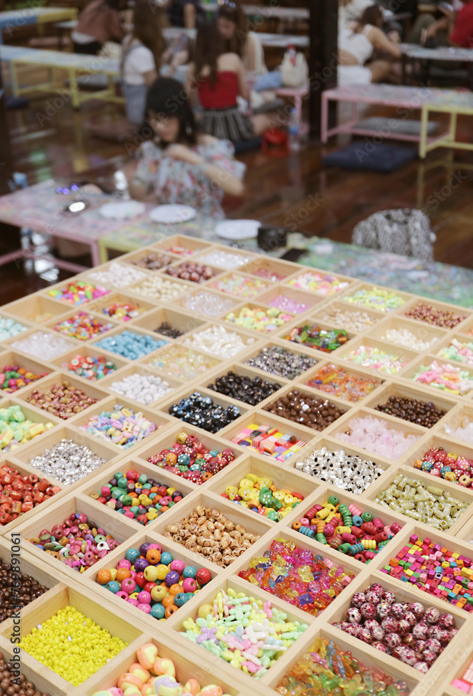 Closeup of Wooden Compartment Display Boxes of Beads in DIY Beading Workshop Room