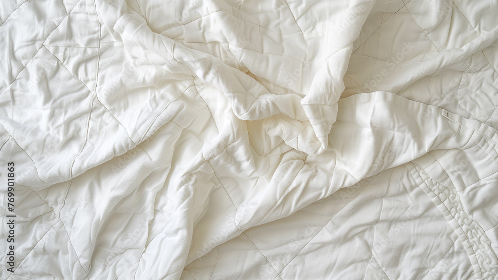Cozy and Warm: Overhead Shot of a White Cotton Quilt Cozy and Warm: Overhead Shot of a White Cotton Quilt
