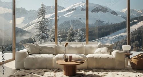 A cozy living room with large windows, showcasing the snowy mountains outside and a comfortable sofa in neutral tones © Chand Abdurrafy