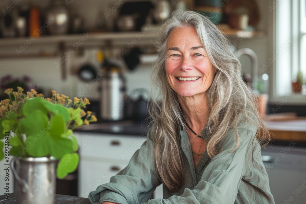 Smiling senior woman sitting in domestic kitchen at home, Smiling senior woman sitting in domestic kitchen at home,
