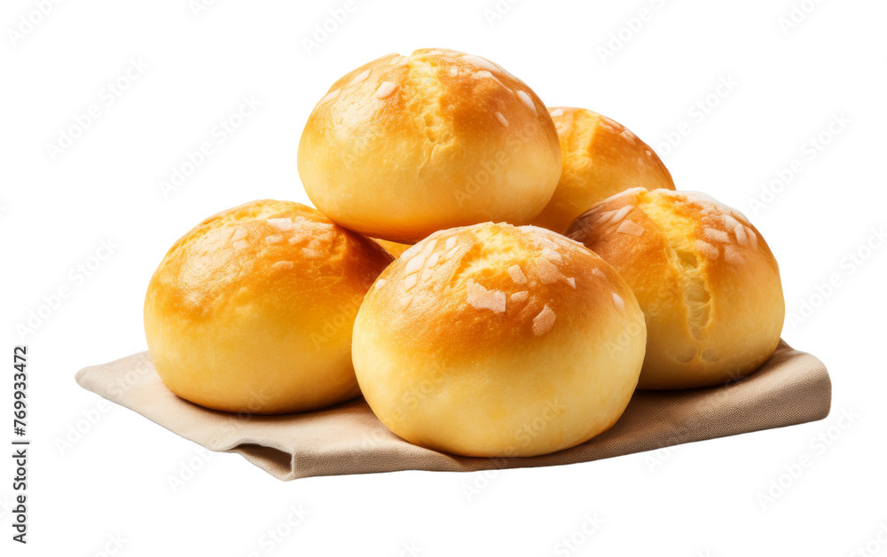 A stack of bread rolls rests on a white napkin A stack of bread rolls rests on a white napkin