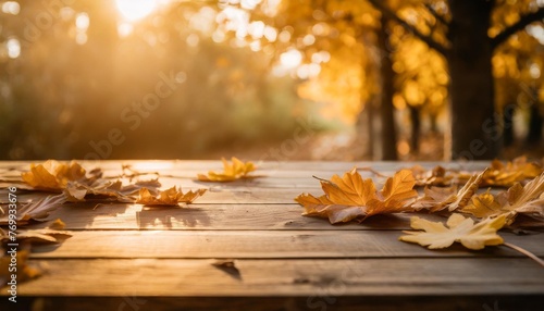 wooden background with autumn leaves