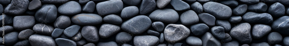 Top view of worn river stones. Textured background or banner. Top view of worn river stones. Textured background or banner.