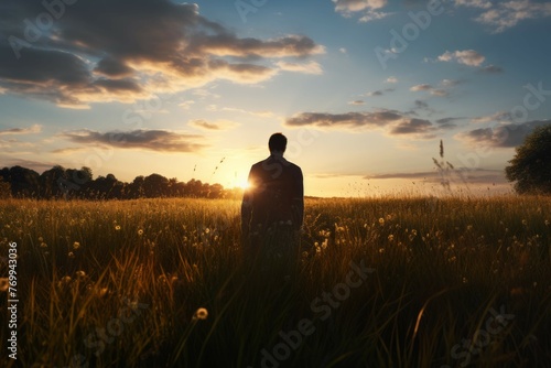 Back view of a person in a meadow