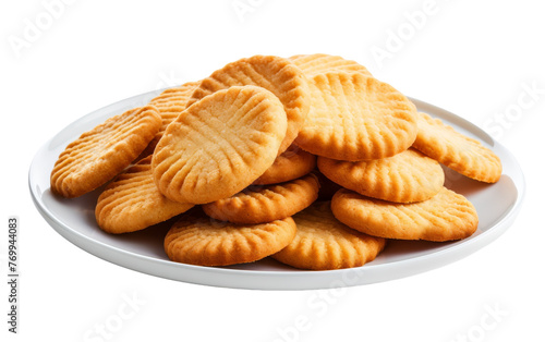 White plate holding an array of cookies on a pristine table