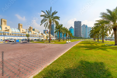 View from Central Souk Park of the Blue Souq shopping mall and downtown Sharjah skyline from the waterfront Corniche at Sharjah, United Arab Emirates, December 9 2023. photo