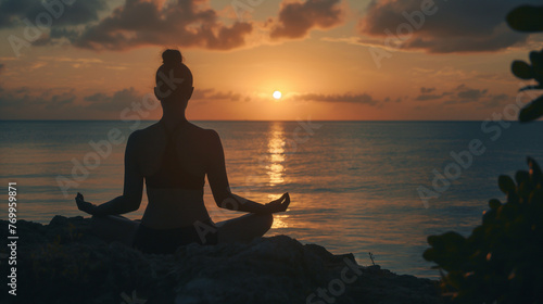 Woman doing yoga at sunset, time for calmness