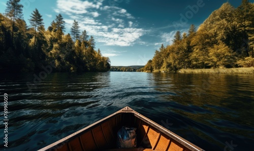 Small wooden boat on the surface in the middle of the beautiful lake in amazing landscape